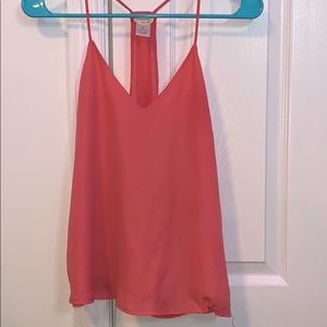 a peach color v-neck tank top